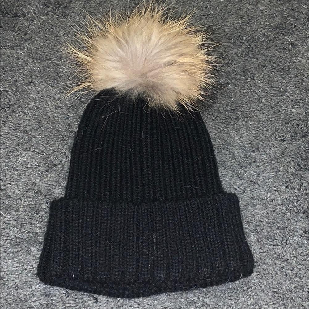black beanie with tan pom